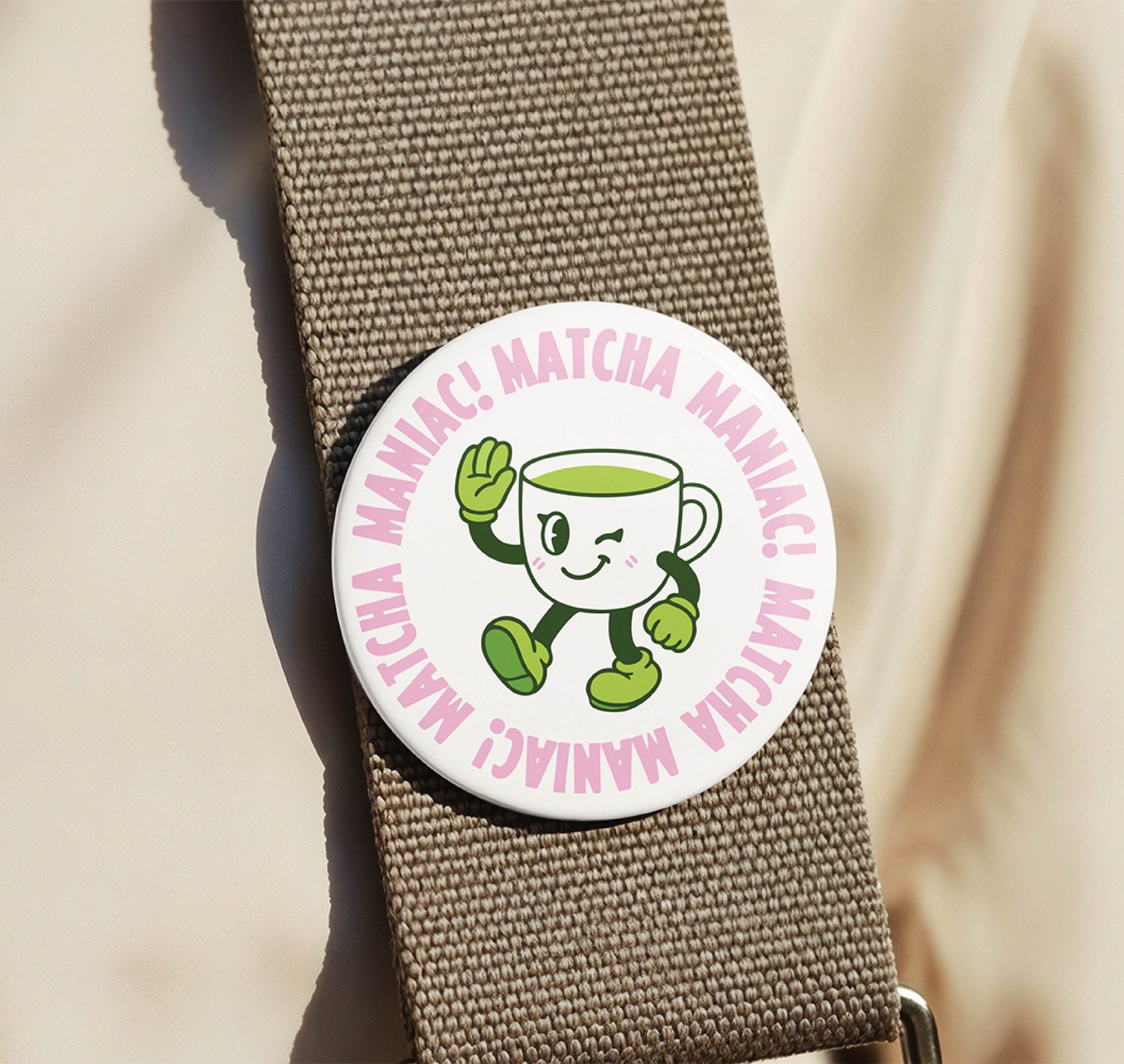Matcha Mania pin-back button reading Matcha maniac